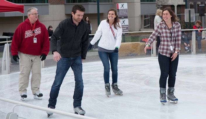 Members of the UNMC public relations staff take to the ice for the Holiday Skate.
