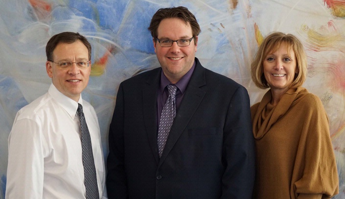 From left, Andrew Patterson, M.D., Ph.D., associate director, Geoffrey Talmon, M.D., director, and Kim Michael, associate director of the Interprofessional Academy of Educators