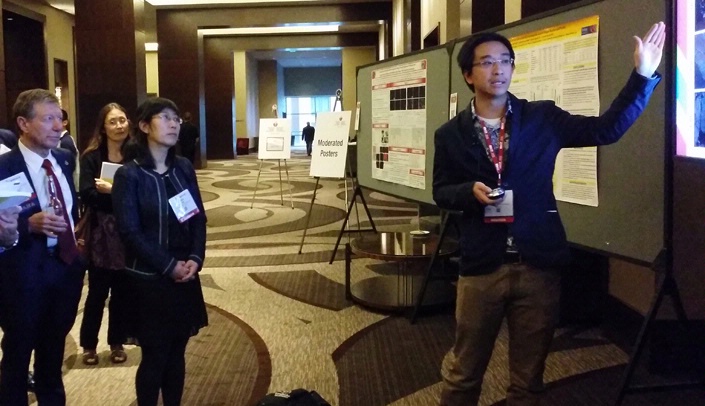 Duy Ha presents his research at the moderated poster session at the American Heart Association meeting in Nashville last week.