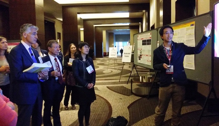 Duy Ha presents his research at the moderated poster session at the American Heart Association meeting in Nashville last week.