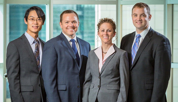 From left, graduating orthopaedic residents Paul Hong, M.D., Paul Nielsen, M.D., Kaitlin Neary, M.D., Scott Vincent, M.D.