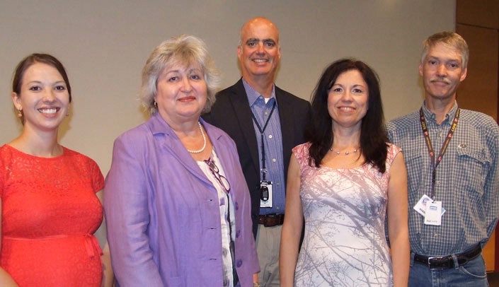 Ted Mikuls, M.D. (center), vice chair for research in the UNMC Department of Internal Medicine, is flanked by four award winners (from left) Javen Wunschel, D.O., Susan Swindells, M.B.B.S., Diana Florescu, M.D., and Arthur Heires.