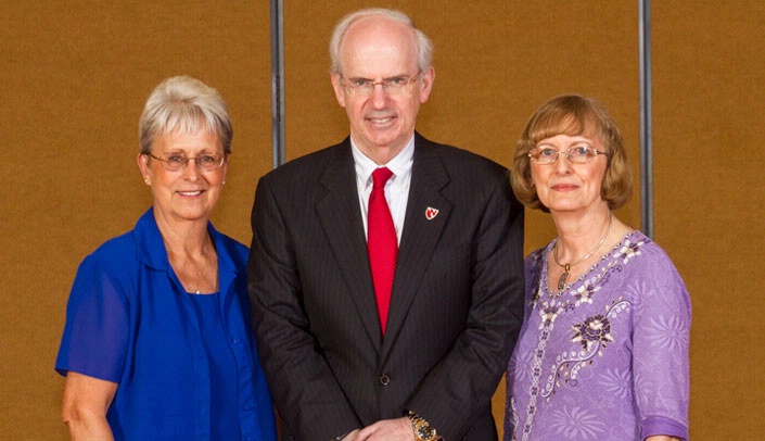 UNMC 45-year service awardees Beverly Hulsebusch, left, and Margaret Sieber, right, with UNMC Chancellor Jeffrey P. Gold, M.D., at the event.