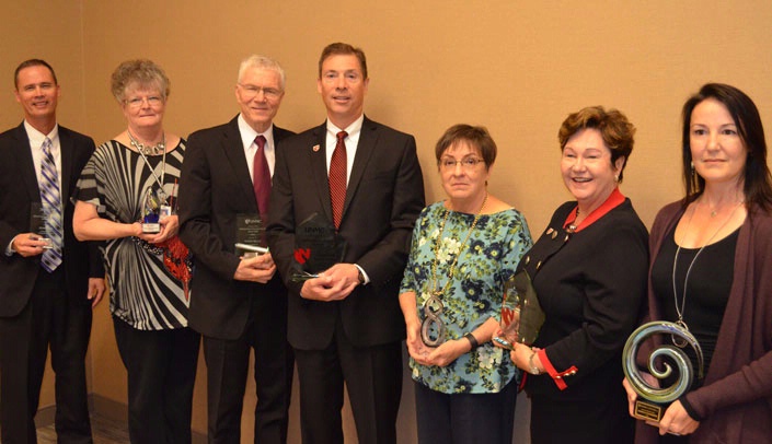 Award winners included, from left, Joel Travis, M.D., Sue Pope, Roger Wells, Kyle Meyer, Ph.D., Lois Colburn, Juliann Sebastian, Ph.D., and Danielle Dohrmann.