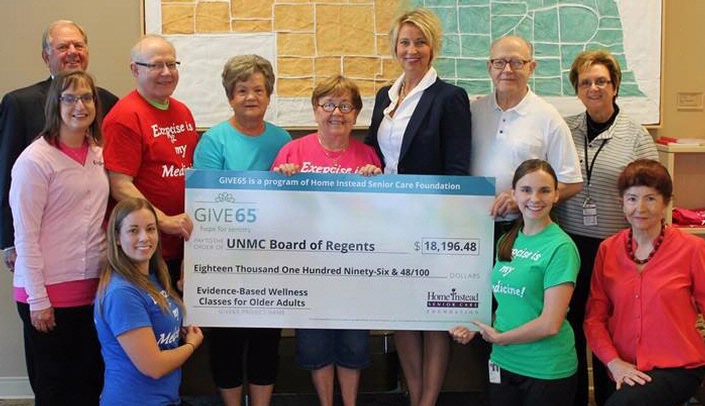 Left to right: Roger Baumgart, executive director of Home Instead Senior Care Foundation; Jeannie Hannan, manager of EngAge Wellness; Sara Huebert, wellness specialist at EngAge Wellness; Joe Nebel, EngAge Wellness participant; Pat Blankenship, EngAge Wellness participant; P.K. Moran, EngAge Wellness participant; Lori Hogan, vice president and secretary of the Home Instead Senior Care Foundation Board; Jim Nebel, EngAge Wellness participant; Chris Kocol, operations assistant for EngAge Wellness; Jane Potter, M.D., medical director of EngAge Wellness; and Heather Shafer, wellness specialist for EngAge Wellness