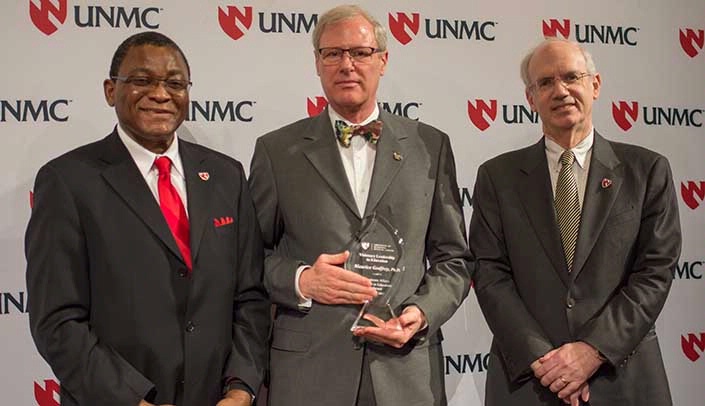 Maurice Godfrey, Ph.D., center, with Vice Chancellor for Academic Affairs Dele Davies, M.D., left, and UNMC Chancellor Jeffrey P. Gold, M.D., right.