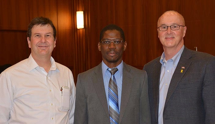 Ernest Chivero, Ph.D., center, at the University of Iowa Graduate College dissertation award ceremony with his mentor, Jack Stapleton, M.D., professor of internal medicine and microbiology, at left, and John Keller, Ph.D., associate provost for graduate education and dean of the graduate college, both at the University of Iowa.