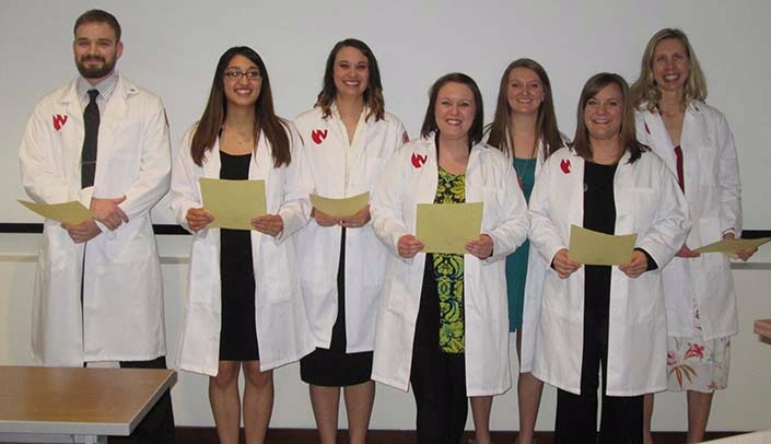 Accelerated nursing students at the UNMC Kearney Division participated in the Nightingale White Coat Ceremony March 31. Pictured are (from left): Daniel Nielsen, Ogallala; Estrella Monrroy, Cozad; Melissa Langenberg, Gering; Stephanie Korus, Beatrice; Brandie Janssen, Alma; Kristin Henggeler, Eustis; and Helen Albrecht, Kearney. Not pictured: Keely Envick, Shelton.