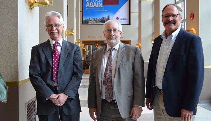 From left, Tom Williams, M.D., chief medical officer and director of the Division of Public Health for the Nebraska Department of Health and Human Services, Brad Britigan, M.D., dean of the UNMC College of Medicine, and Tom Rauner, health program manager of the NDHHS Office of Rural Health & Primary Care.