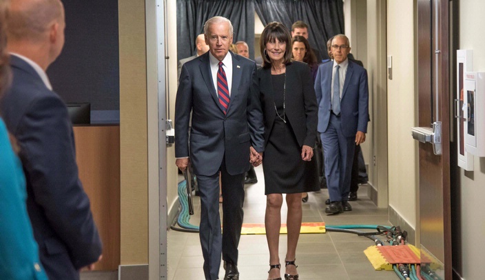 Joe Biden escorts Pamela Buffett, the lead donor to the Fred & Pamela Buffett Cancer Center, into the ribbon-cutting ceremony.