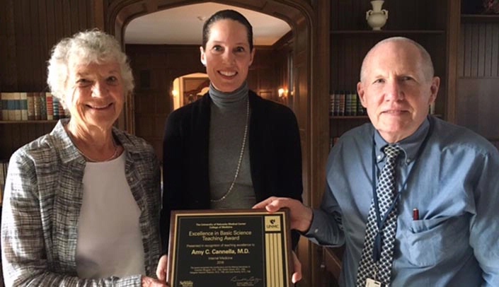 From left: Carol Swarts, M.D., COM 1959, Amy Cannella, M.D., associate professor, internal medicine-rheumatology, COM, 1997, and Gerald Moore, M.D., professor and senior associate dean-academic affairs, UNMC College of Medicine, COM, 1971