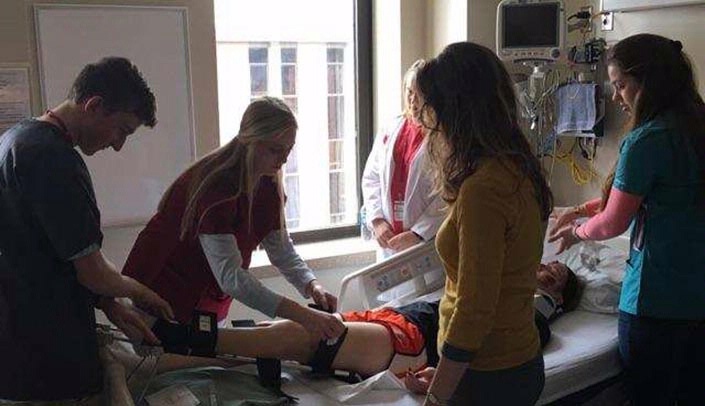 Students work with a simulated patient during UNMC/Nebraska Medicine's CAREEROCKIT event.