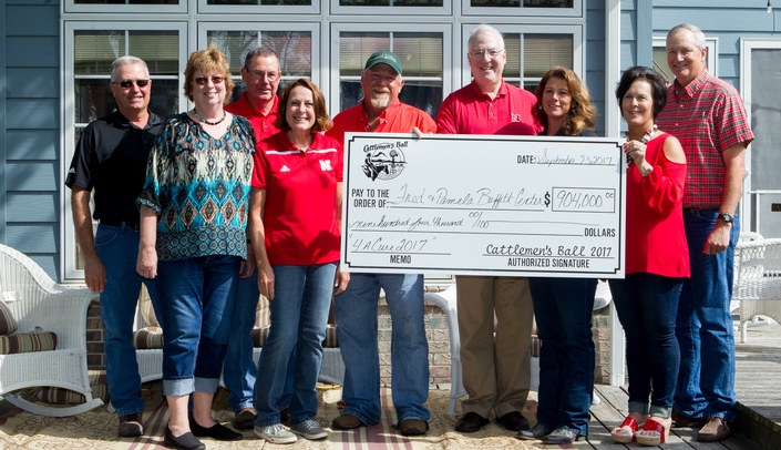 Organizers and hosts of the 2017 Cattlemen's Ball present a $904,000 check to Dr. Kenneth Cowan of the Fred & Pamela Buffett Cancer Center at University of Nebraska Medical Center on Sept. 23. From left: Don and Deb Cantrell; Jeff and Karen Evans; Jeff Johnson, host; Dr. Cowan; Lisa Johnson, host; and Cindy and Jim Duncan. Photo courtesy of Becky Finney.