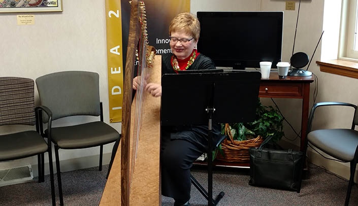 Anita Jaynes performs holiday songs for faculty and staff.