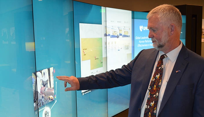 State Sen. John Lowe uses the iWall in the iEXCEL Visualization Hub.