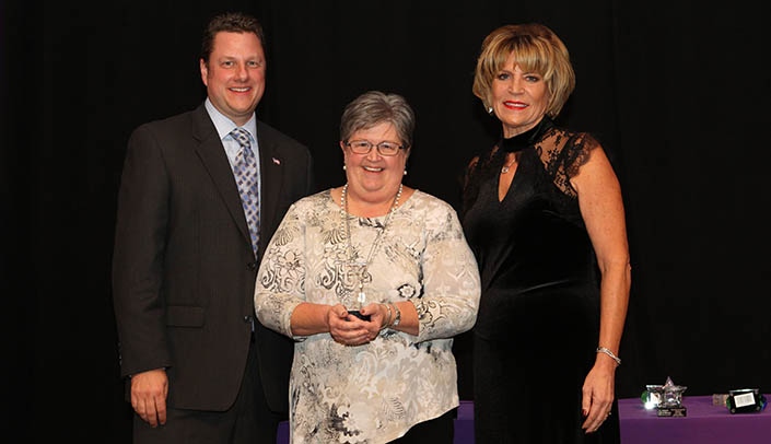 Connie Miller, Ph.D., is flanked by Eric Younger, board member of the March of Dimes and Sharon McArdle, director of nursing at Methodist Women's Hospital.