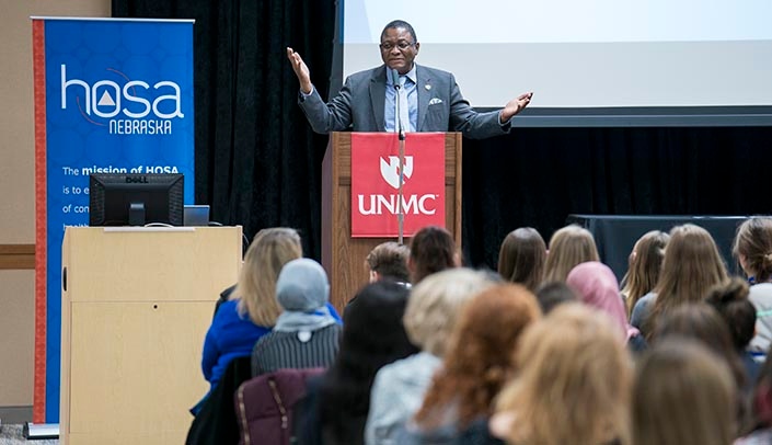 Senior Vice Chancellor for Academic Affairs Dele Davies, M.D., greets students from across Nebraska who attended the HOSA conference at UNMC.