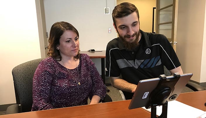 Project coordinator Tara Harper and employment service liaison Ian Froemming test communication equipment that may be used as part of the new employment initiative.