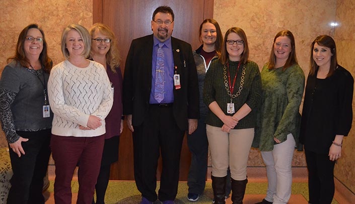 From left, Karin Carlson, Kristi DeHaai, Kari Price, MMI Director Karoly Mirnics, M.D., Ph.D., Natasha Chamberlain, Joanna Spaulding, Tricia Saxton and Monica Pleiss.