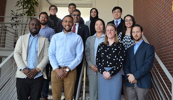 Winners of the Student Research Conference poster competition were, from left: (first row) Karl Bisselou, Anthony Blake, Gwenndolyn Porter and Richard Sleightholm. (Second row) Gaurav Kumar, College of Public Health Dean Ali S. Khan, M.D., M.P.H., Minh Nguyen and DaiTrang Lee. (Third row) Dr. Tricia LeVan, Roger Gonzales, Rima Albalushi and Zijian Qin.