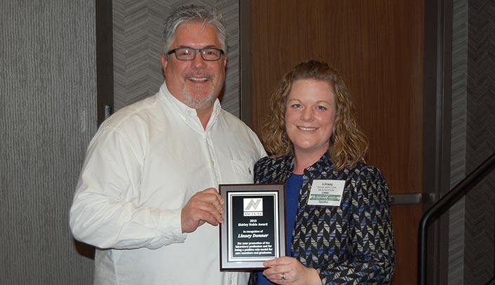 ASCLS-NE president-elect Brad Hays presents Linsey Donner with the Shirley Noble Award