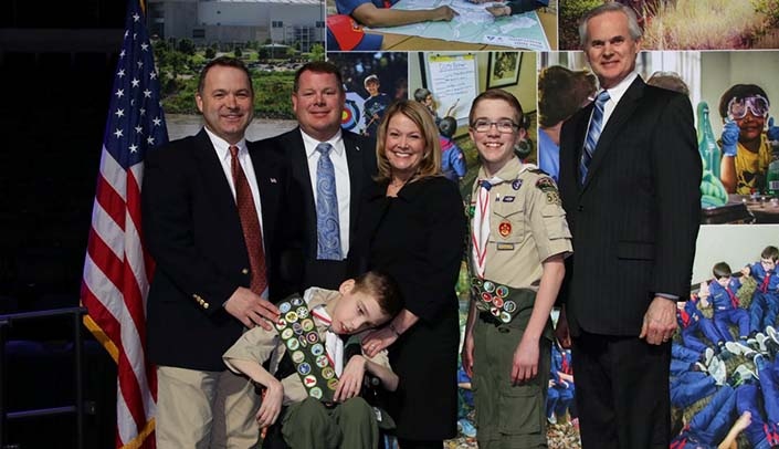 From left, back row: Boy Scouts of America-Mid-America Council Chairman Drew Blossom, Carl Falk, Kim Falk, Andrew Falk and Lt. Gov. Mike Foley; front row, Ethan Falk.