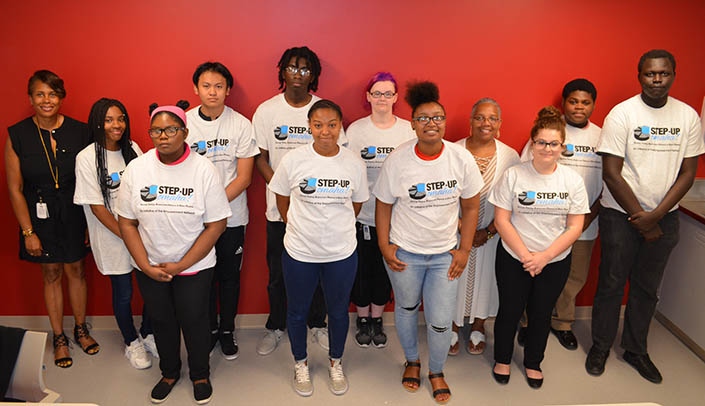 Step Up coordinators and participants. Front row, from left, Lashaia Bass, Wylesha Cleghorn, Asinie Williams, Jessica Infante-Betchel: back row, from left, Aileen Warren, assistant vice chancellor for human resources, Tanayzia Jemes, Saw Khu, Billy Hubbard, Andrea Sorensen, program coordinator Evelyn Grixby, Dontay Jackson and Ngom Mamed.