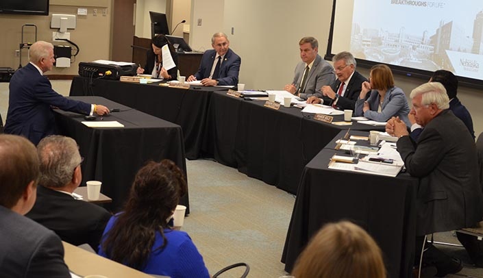 Sen. Matt Williams, left, speaks before the Appropriations Committee of the Nebraska State Legislature, which met at UNMC on Friday.