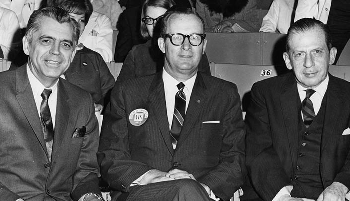 From left, Clifford Hardin, Ph.D., UNL; Kirk Naylor, Ed.D., UNO; Cecil Wittson, M.D., UNMC at the convocation about the proposed merger in November 1967.