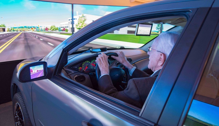 One of the research studies seeking volunteers involves using the advanced driving simulator in the UNMC Mind & Brain Health Labs.