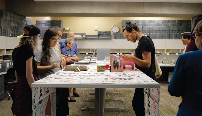 Student work with archival collections at UNO Criss Library.