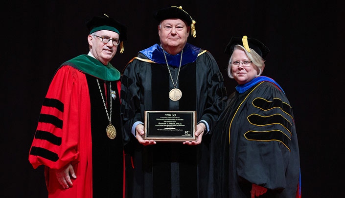 From left, Chancellor Jeffrey P. Gold, M.D., and B.J. Reed, Ph.D., senior vice chancellor of academic affairs, with Susan Fritz, Ph.D., newly appointed interim president-elect of the University of Nebraska, at UNO's May graduation.