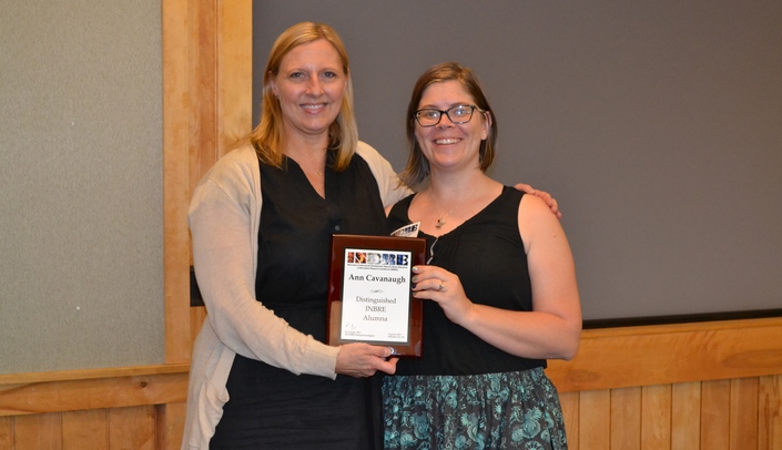 Dr. Julie Strauss-Soukup presents Dr. Ann Cavanaugh with the Distiguished INBRE Alumna plaque.