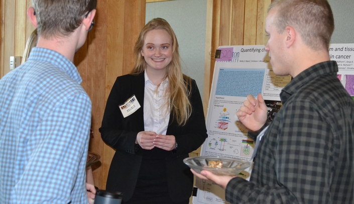 2018 INBRE Scholar Molly Myers discusses her research project at the Nebraska INBRE Annual Meeting held in early August at the Lied Lodge in Nebraska City, Neb.