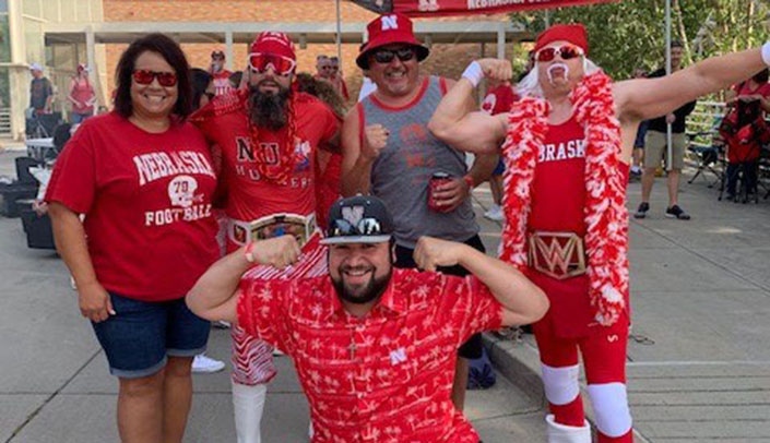 Tricia Munoz, left, gathers with Macho Man, husband Marcos, Hulk Hogan and son Emilio, center,
before a game.