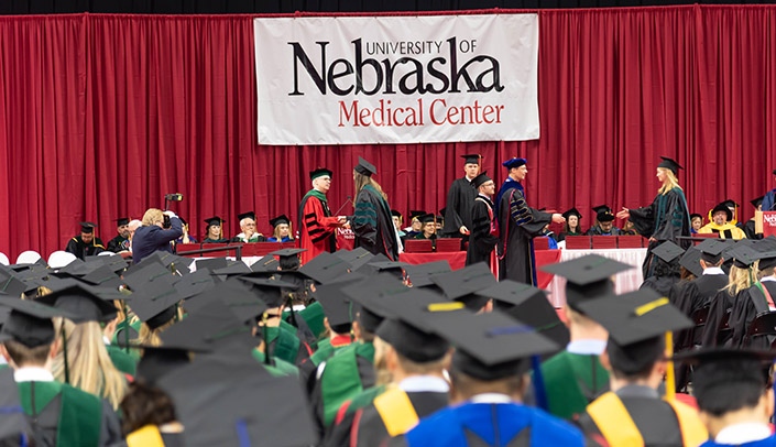 UNMC will return to in-person commencement ceremonies this year, although de-densification strategies and other COVID-19 safety measures will make the ceremonies look different from this event in 2019.