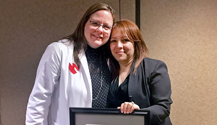 Charity Evans, MD, left, with Raquel Salinas