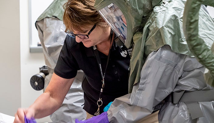 Shelly Schwedhelm, executive director of emergency management and biopreparedness at Nebraska Medicine, assists with National Disaster Medical System training.