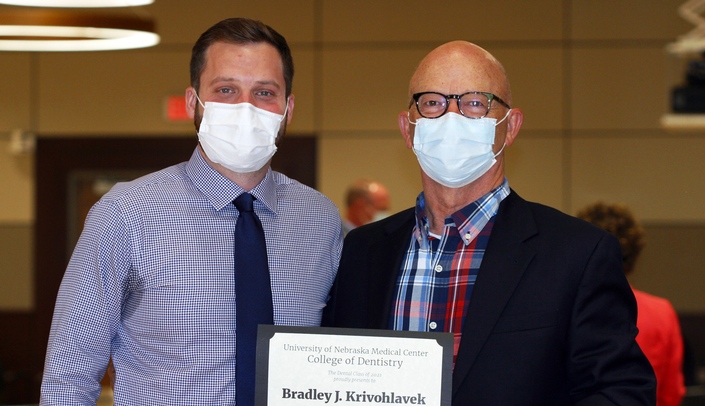 Bradley J. Krivohlavek, DDS (left) with Zach Pederson, president of the dental class of 2020.