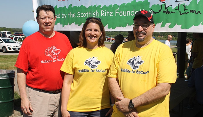 From left, John Maxon of the Scottish Rite and the Munroe-Meyer Institute's Amy Nordness, PhD, and director Karoly Mirnics, MD, PhD, at the 2019 WalkRite for RiteCare.