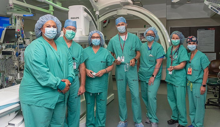 At the cardiac catheterization laboratory, from left, Nichole Niehus, lab manager); Daniel Anderson, MD, PhD, chair of the UNMC Division of Cardiovascular Medicine; Sen. Deb Fischer; Andrew Goldsweig, MD, associate cath lab director for structural heart disease); Lisa Drew, cath lab nurse specialist); Jaclyn Rivington, MD, UNMC cardiovascular medicine Fellow); and Katie Connell, cath lab technologist