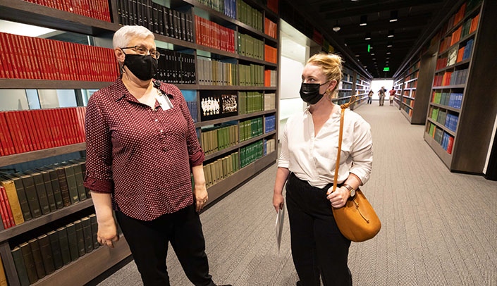 From left, Emily McElroy, dean of the McGoogan Health Sciences Library, and Nebraska State Sen. Megan Hunt