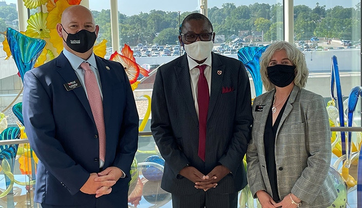 From left, Jeff Hoffman, DPE, dean of health and public service at Northeast Community College, Dele Davies, MD, senior vice chancellor of academic affairs at UNMC, and Leah Barrett, EdD, president of Northeast Community College in Norfolk, tour the Chihuly Sanctuary.