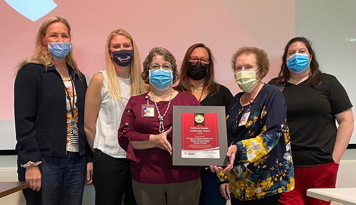 Mia Hyde, associate program director/director of clinical development, physician assistant education; Jannelle Reynolds, assistant professor of PA education; Mary Girard, instructor, nursing; Pam Dickey, assistant professor and admissions director, PA education; Nancy Stuart, instructor of nursing; and Katie Messner clinical instructor, nursing, accept the award on behalf of UNMC, the HSEC and its students.