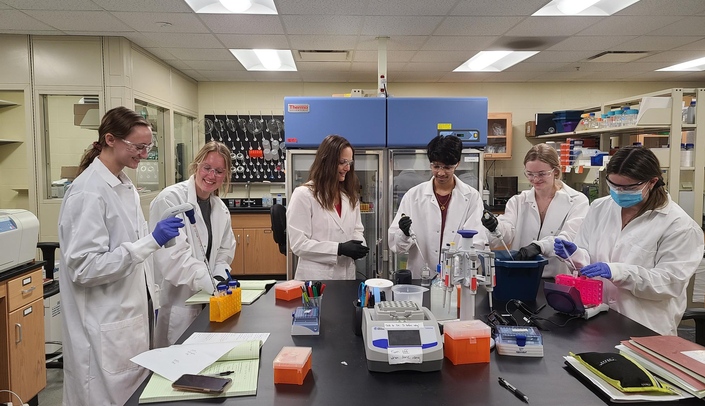 Creighton University undergraduates join Dr. Lynne Dieckman in the lab. Pictured left to right are: Keely Orndorff, Olivia Nicholson, Dr. Dieckman, Neal Sinha, Grace Majeres and Molly Dolan.
