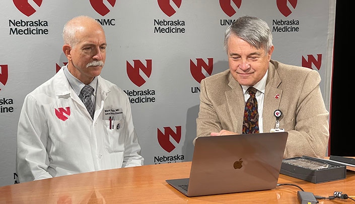 Mark Rupp, MD, (left) was accompanied by CEO Jim Linder, MD, to learn the news of his award from the Nebraska Hospital Association.