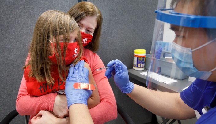 Nicole Kolm-Valdivia&comma; PhD&comma; UNMC&apos;s interim assistant dean for academic affairs&comma; took her two children&comma; including Vivian&comma; 5&comma; to receive their COVID-19 vaccinations in early November&period;