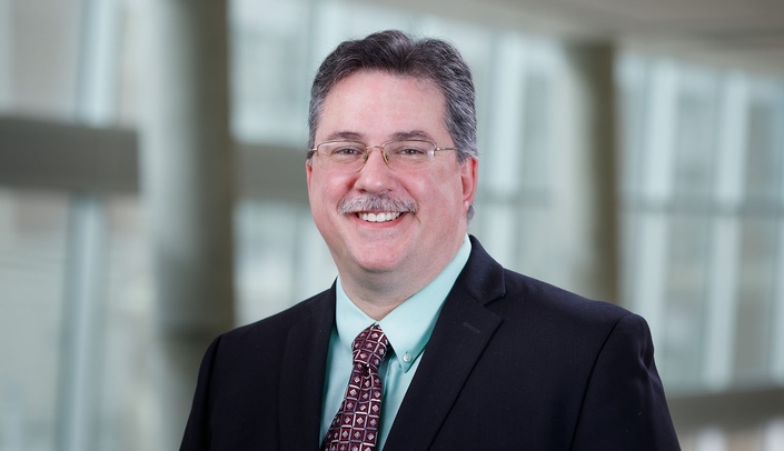 Justin Mott, MD, PhD, associate professor of biochemistry and molecular biology