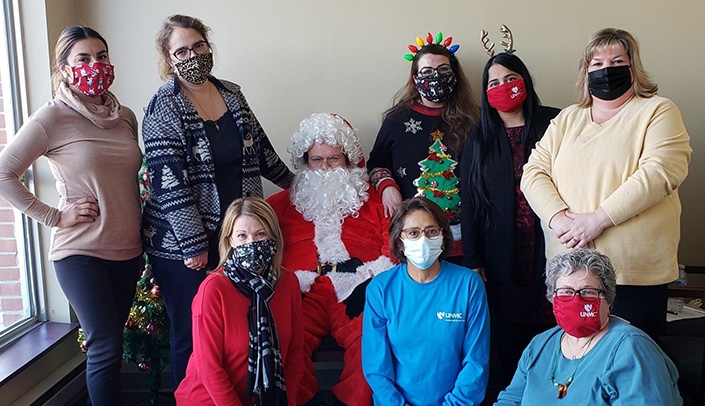 Event organizers and Santa (Tony Gutierrez): Back row, from left, Rita Rodriguez from La Nueva Radio station and Miss Latina Nebraska Pageants, Sarah Swanson, Jessica Gutierrez, Shaistha Karipi and Anne Brodin from United Cerebral Palsy of Nebraska; front row, from left, Kim Falk, Graciela Sharif and Ellen Bennett.