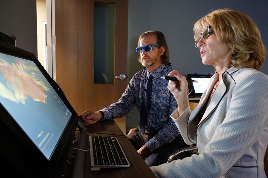 Dr. Jennifer Cera and iEXCEL visualization hub director Bill Glass review a 3D rendering of the female pelvis.